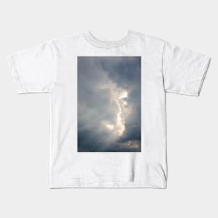 Sunbeam between storm clouds cloudscape sky Kids T-Shirt